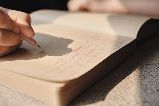 A hand writing in Journal