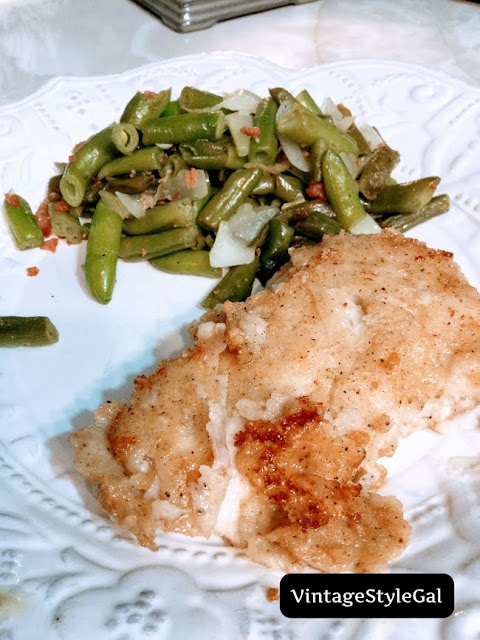 Fried haddock with green beans on stoneware plate