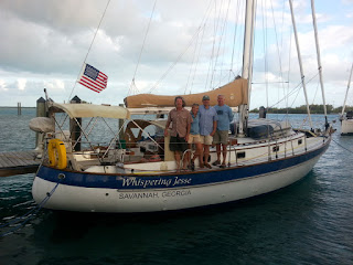 Mike, Nan, John and Brian aboard Whispering Jesse at Blue Water Marina