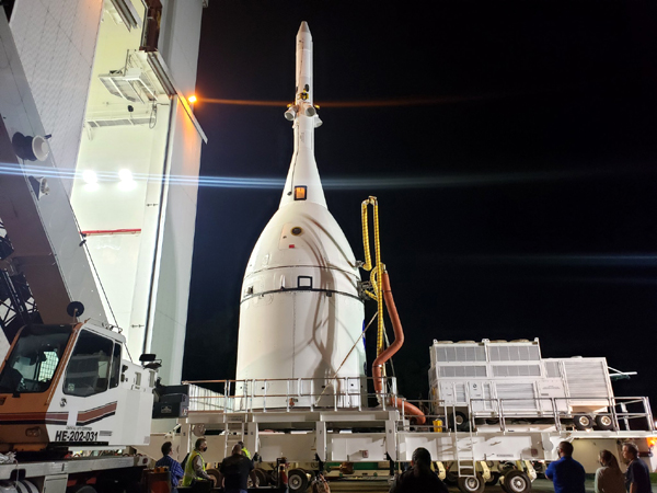 The transporter carrying the Orion Artemis 1 spacecraft exits from the Launch Abort System Facility to make its way to the Vehicle Assembly Building at NASA's Kennedy Space Center in Florida...on October 18, 2021.