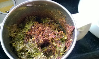 Add cooked tamarind leaves & grind