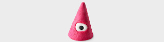 A triangular cone orange shaped bubble bar with an white eye in the middle on a bright background