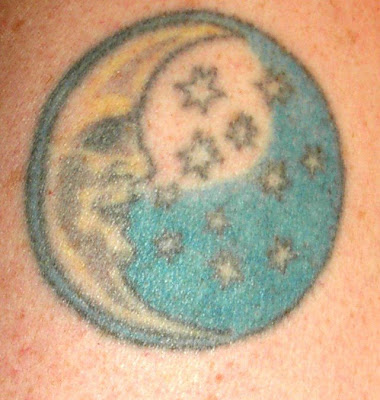 moon and sun tattoo. The banded tattoo below the