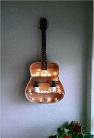 Old guitar you can reuse as a book shelves