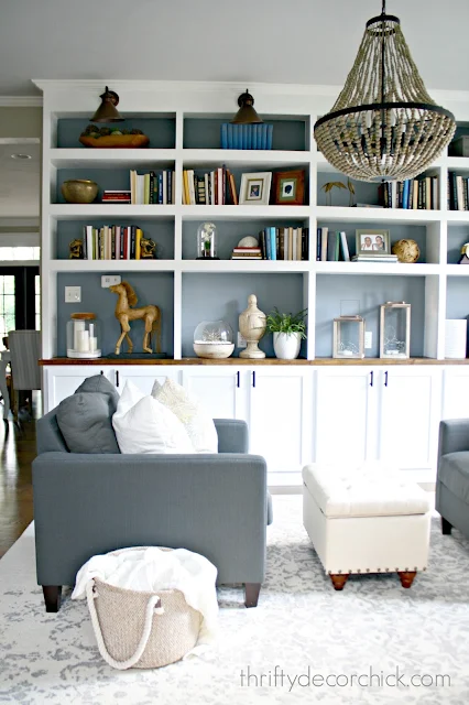 wall of DIY bookcases using kitchen cabinets