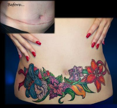cat tattoo on belly. Flower stomach tattoo.