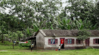 People help showing the way to the Equator Landmark