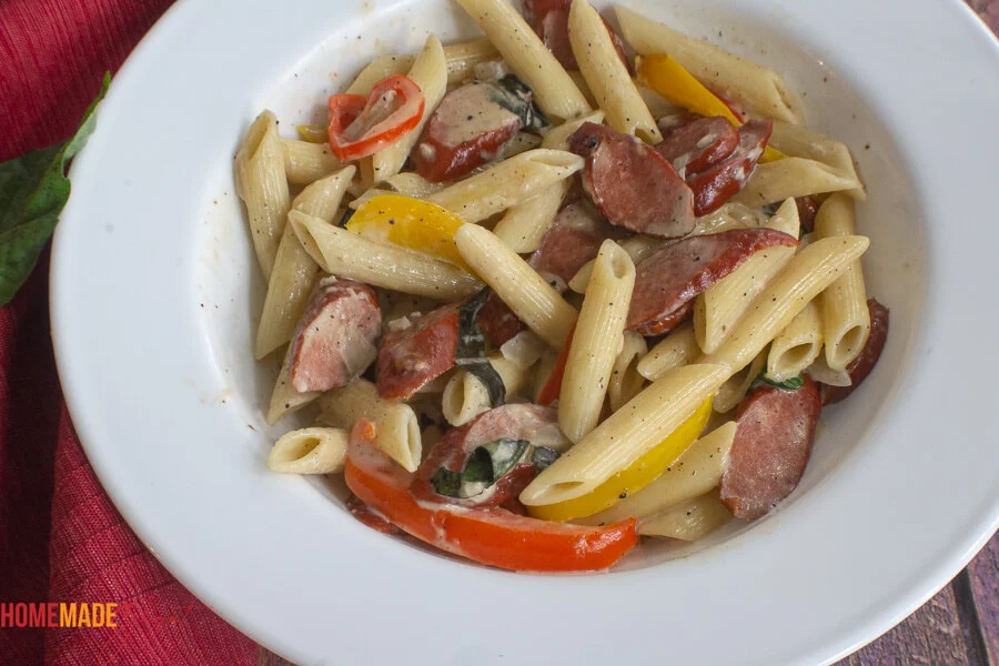 The finished dish of coconut milk pasta in a white bowl.