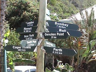 World distances sign Victoria Bay South Africa