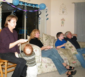 family playing wii women