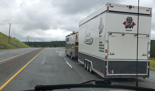 Big motorhome pulling a big trailer on highway 97
