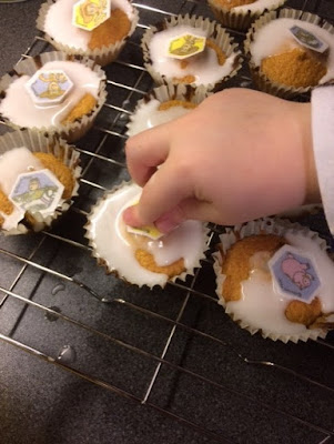 A child decorating cakes