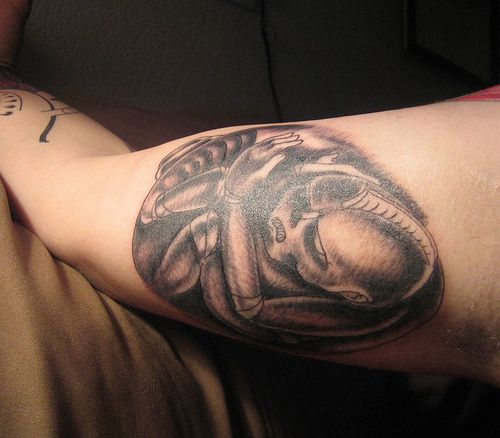 Great alien tattoo ink.