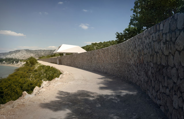 Stone wall with modern villa built above it