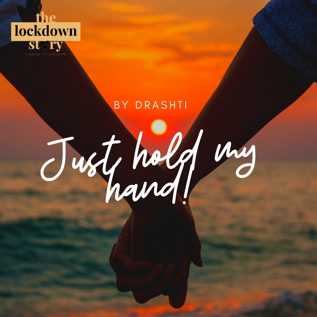 This is picture of a boy and girl holding hand in front of an ocean