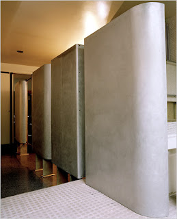 Bathroom with movable panels separating the showers and bathtub