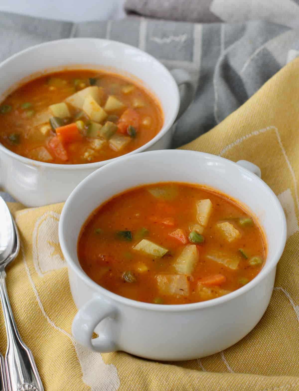 Mexican Vegetable Soup with Chipotles in white bowls.