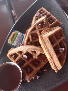 " Chocolate waffles and chocolate syrup with butter from the coffee box"