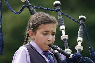 a girl playing the bagpipes