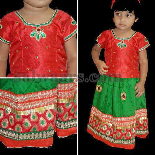 Baby in Green and Red Skirt