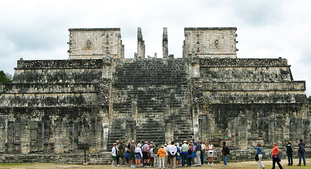 A carving of Chac Mool on top of the The Temple of the Warriors at Chichen Itza, Mexico.