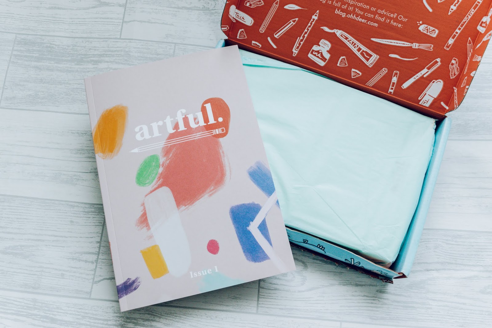 An Artful magazine and a box opened.