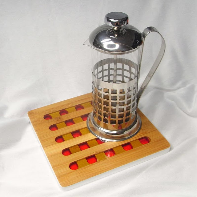 Resin and bamboo trivet with coffee plunger