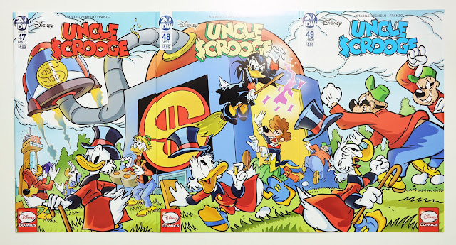 IDW's Uncle Scrooge #47-49, printed comics next to eachother