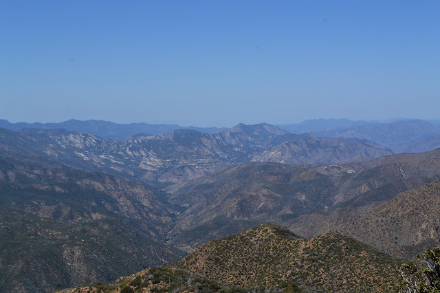 mountain with white stripes around its base