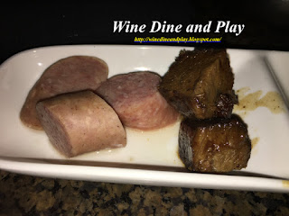 Some German bratwurst sausage and beef sauerbraten dippers to go with the Oktoberfest fondue at the Melting Pot restaurant in St. Petersburg, Florida.