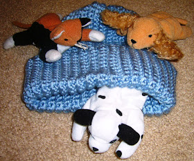 Hand knitted hats and stuffed animals for shoe boxes