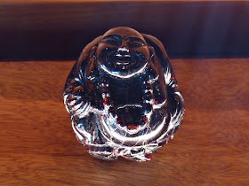 Happy Buddha carved from garnet