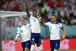 Marcus Rashford celebrates goal with teammates, Harry Kane and Phil Foden as England wallops Iran 6-2 in their FIFA World Cup 2022 opener match