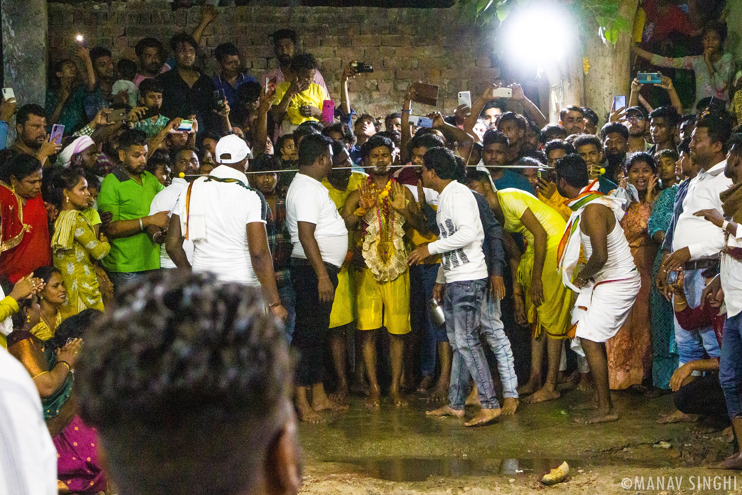Tamil Hindu devotees cheeks pierced metal rods Sheetla Mata Maha Mariamman fire walking