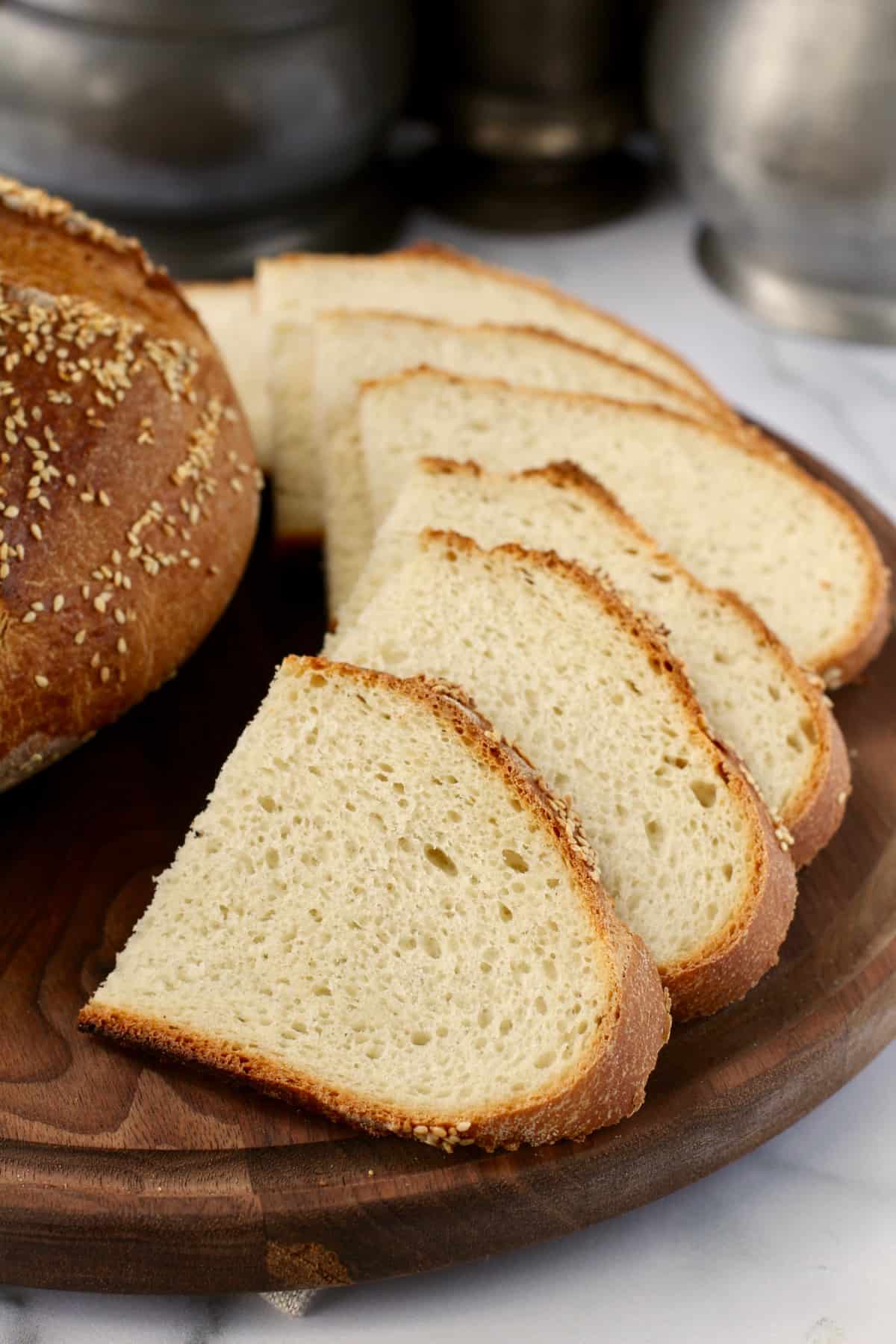 Greek Village Bread (Horiatiko Psomi) with semolina sliced on a cutting board.