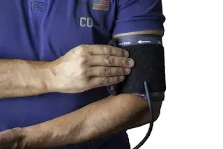 A picture of a patient checking his blood pressure
