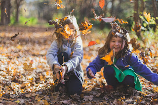 Kids Playing In Leaves