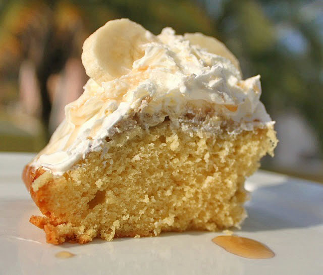 banana cake topped with rum and whipped cream