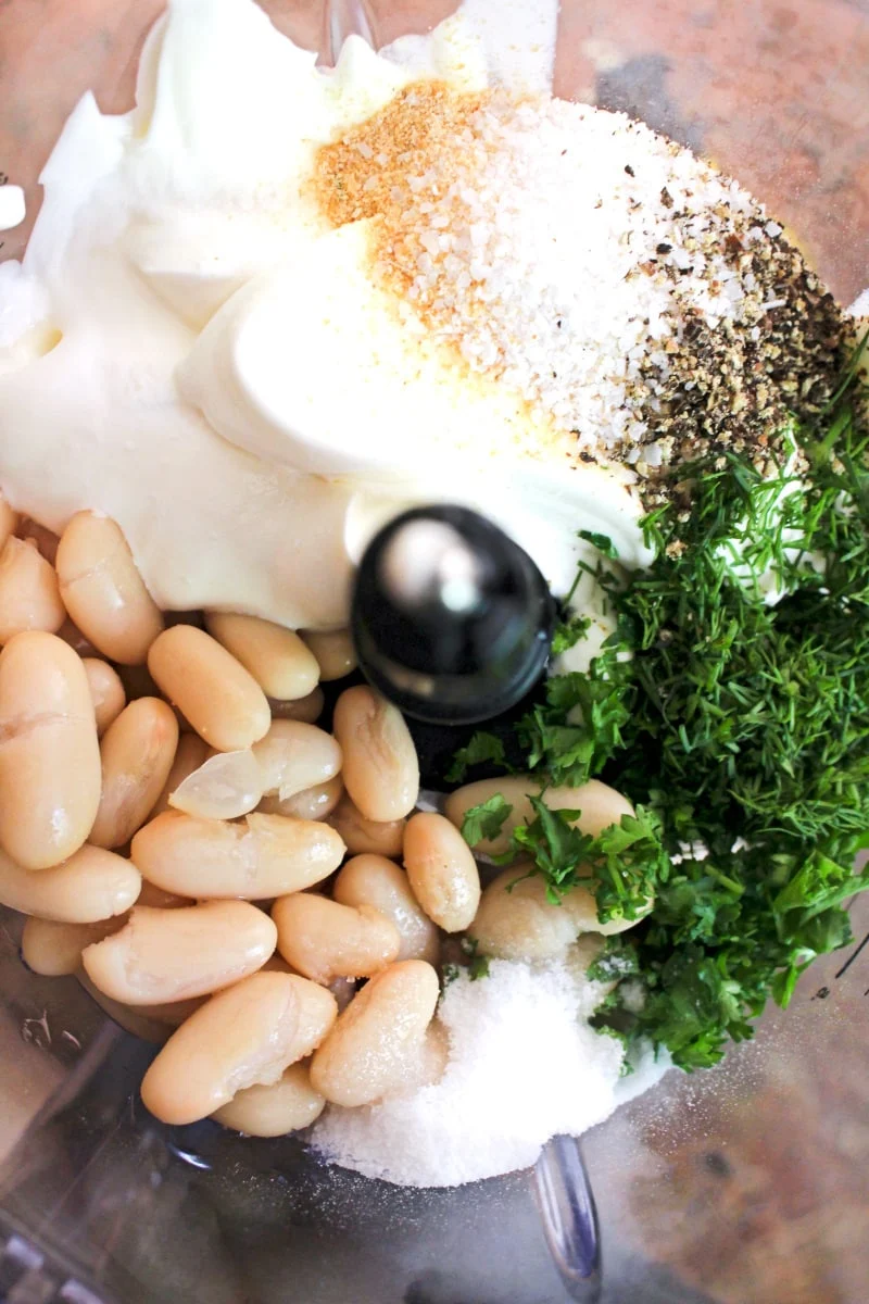 Close up of dill dip ingredients in a blender.