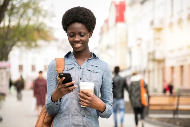 A lady holding a phone.