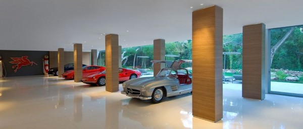 Vintage car collector's Glass Pavilion |  Steve Hermann  the ultimate Vintage car collector's crash pad in Montecito, California, a modernist masterpiece designed to house a world-class collection of 35 Vintage cars. that's $1 million per car  in a stunning automotive art gallery.