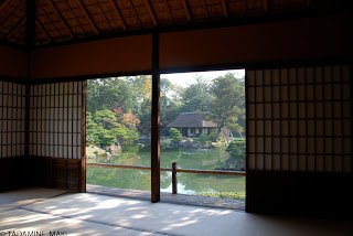 A pond and a rustic house seen from the inside, at Katsura Imperial Villa, in Kyoto