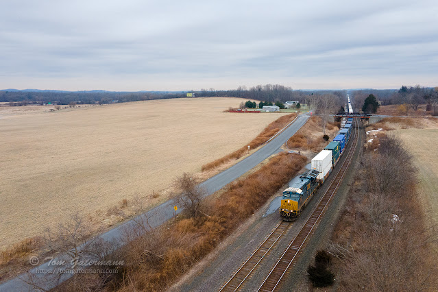 CSXT 3436 leads I01710 west under the Oakland Rd. bridge at Weedsport, NY.