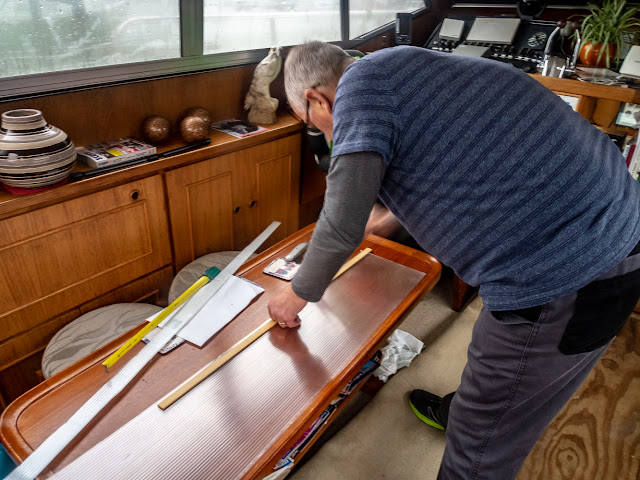 Photo of Phil marking the multi-wall polycarbonate sheet ready for cutting