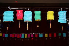A row of multicoloured Chinese lanterns at a party