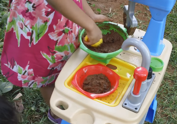 Kid playing with mud