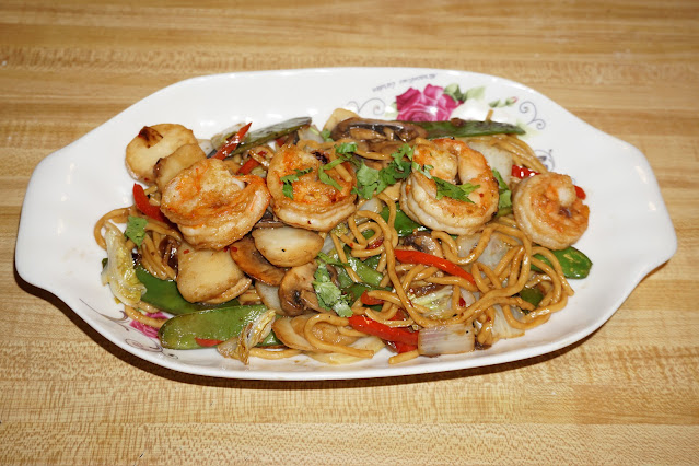 This recipe consists of Chinese noodles stir fry with shrimps and vegetables. Covered with a sauce made with hoisin sauces and chili pepper. You can always adjust the chili pepper amount to your own taste.