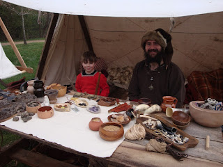 A Viking Merchant and his son travel with the warriors and display goods found at Viking sites.