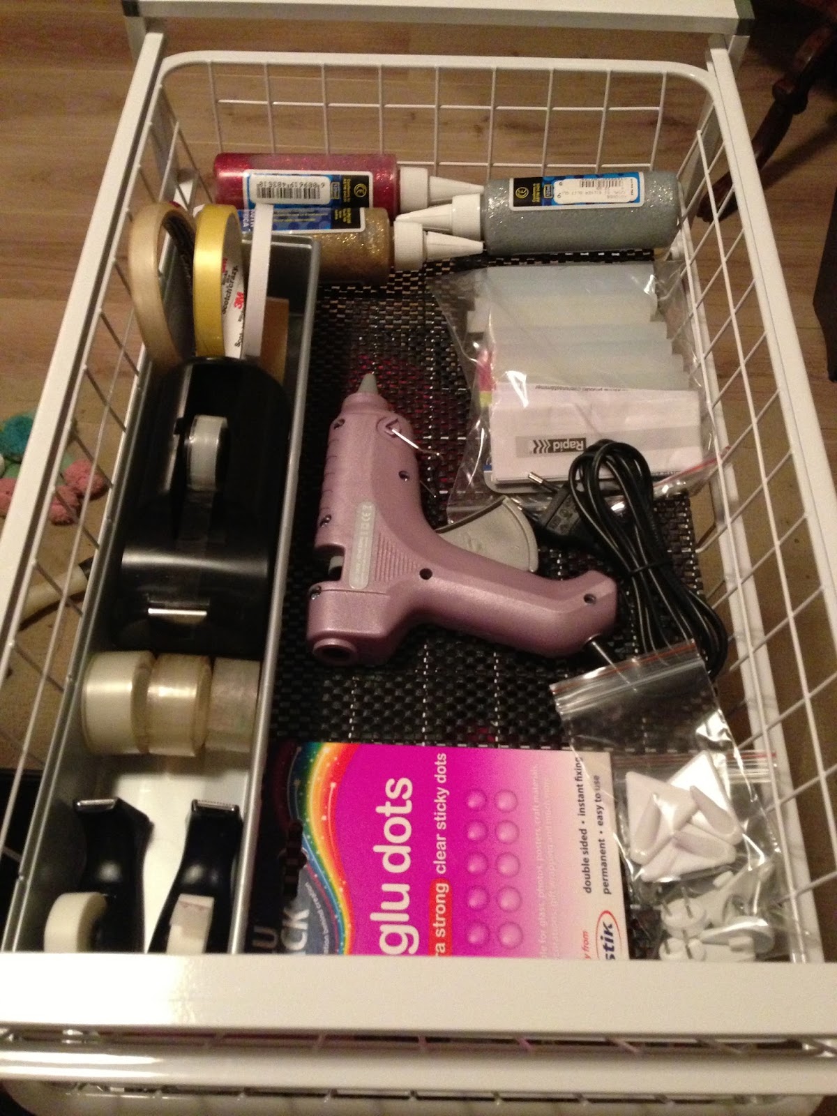 Top drawer holds various types of tape, glue dots, glitter glue & hot ...
