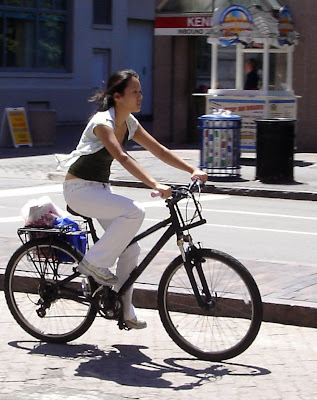 girl on bike in white top